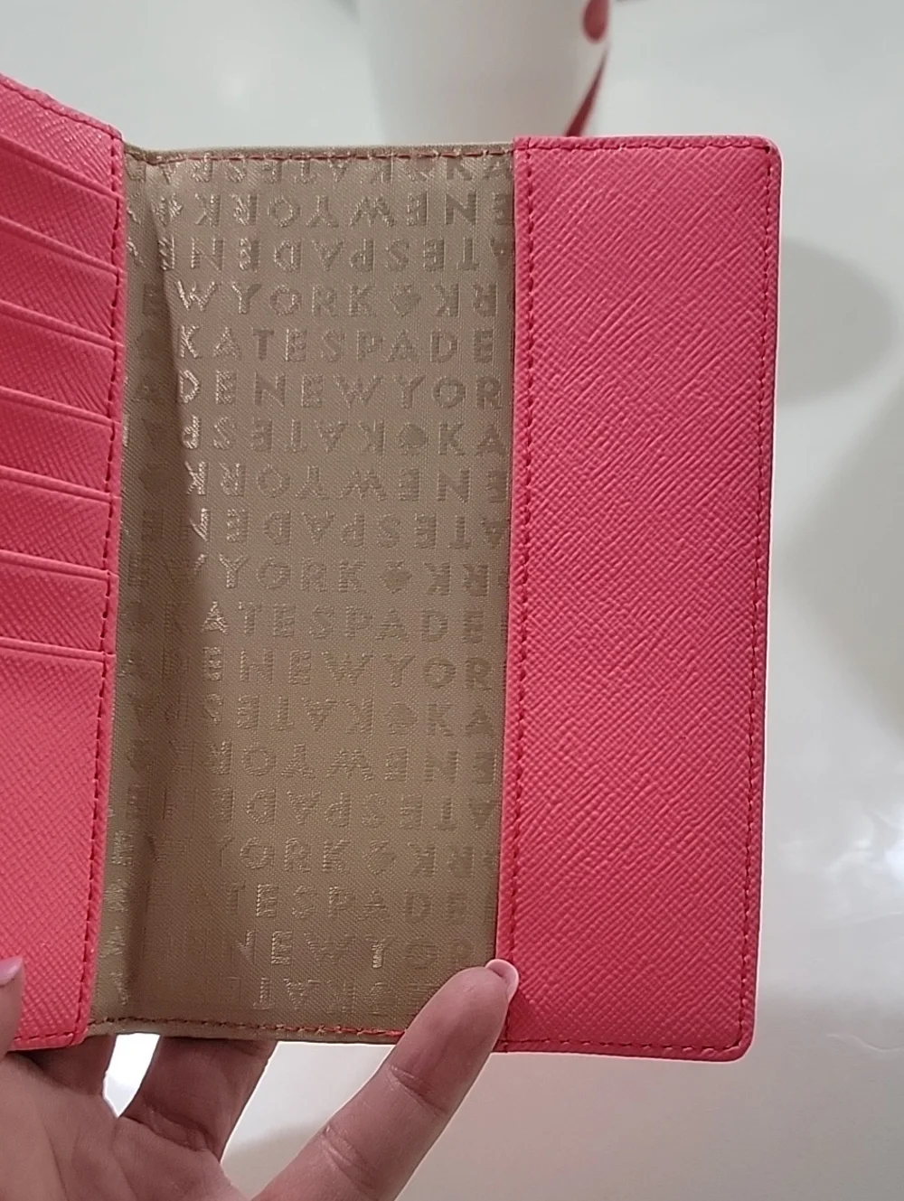 kate spade coral Talk The Talk Imogene Passport Holder Featuring Parrot